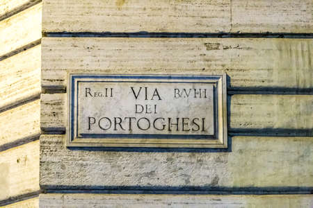 ROME, ITALY - JANUARY 3, 2019: light is enlightening  street name sign of VIA DEI PORTOGHESI