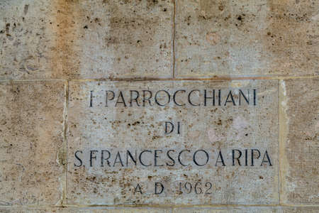 ROME, ITALY - JANUARY 2, 2019: sunlight is enlightening marble plaque in church of San Francesco a Ripa in Romeのeditorial素材