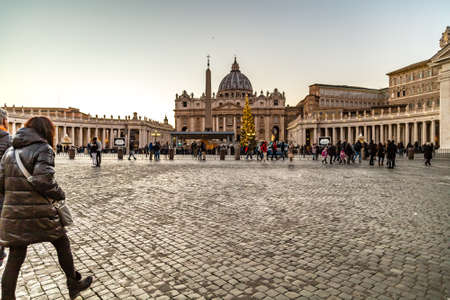 VATICAN - JANUARY 2, 2019: pilgrims, faithfuls and tourists walking in Saint Peter Square in Vatican Cityのeditorial素材