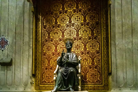 VATICAN - JANUARY 2, 2019: lights are enlightening statue in Saint Peter Basilica in Vatican City