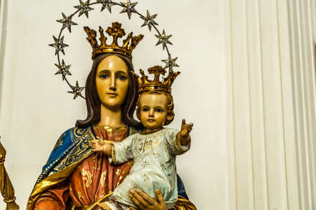 CASTEL GANDOLFO (ROME), ITALY - JANUARY 3, 2019: light is enlightening statue of The Blessed Virgin Mary holding Baby Jesus in Church of Saint Thomas from Villanova in Castel Gandolfoのeditorial素材
