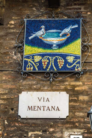 RAVENNA, ITALY - JANUARY 15, 2019: light is enlightening  street name sign of  Via Mentanaのeditorial素材