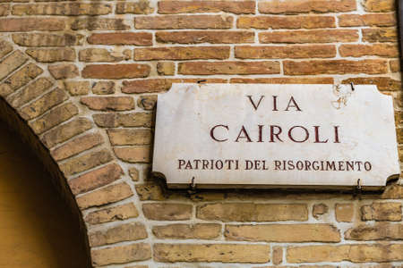 RAVENNA, ITALY - JANUARY 15, 2019: light is enlightening  street name sign of  Via Cairoliのeditorial素材