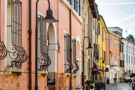 RAVENNA, ITALY - JANUARY 15, 2019: sun light is enlightening street of historical center