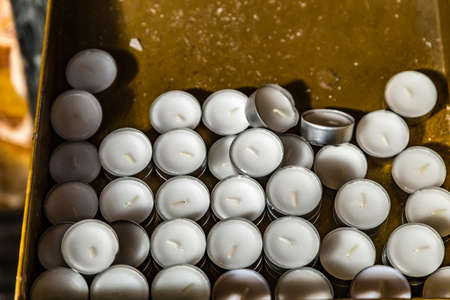 background of unlit white tealights