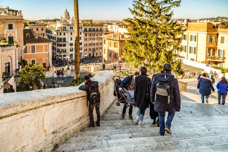 ROME, ITALY - JANUARY 6, 2019: tourists walking in PIAZZA DEI TRINITA DEI MONTI and taking photoのeditorial素材