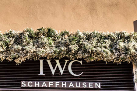 ROME, ITALY - JANUARY 3, 2019: lights are enlightening   IWC SCHAFFHAUSEN logo on storefront