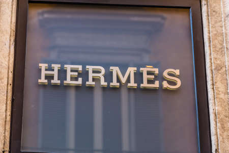 ROME, ITALY - JANUARY 3, 2019: lights are enlightening   HERMES logo on storefrontのeditorial素材