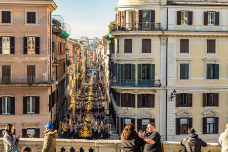ROME, ITALY - JANUARY 6, 2019: tourists taking photos and viewing VIA DE CONDOTTI street from TRINITA DE MONTI in Romeのeditorial素材