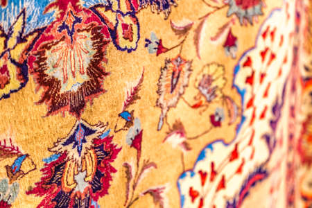 CESENA, ITALY - NOVEMBER 18, 2018: lights are enlightening ancient Eastern rugs for sale in Antiques Fairのeditorial素材