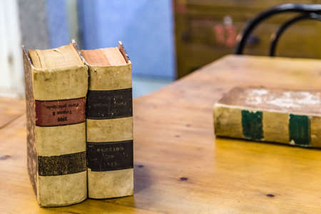 CESENA, ITALY - NOVEMBER 18, 2018: lights are enlightening Upside Down Books for sale in Antiques Fairのeditorial素材