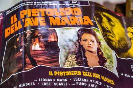 CESENA, ITALY - NOVEMBER 18, 2018: lights are enlightening banner of Italian Spaghetti western movie for sale in Antiques Fairのeditorial素材