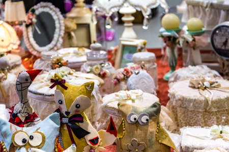 CESENA, ITALY - NOVEMBER 18, 2018: lights are enlightening handmade stuffed animals for sale in Antiques Fairのeditorial素材