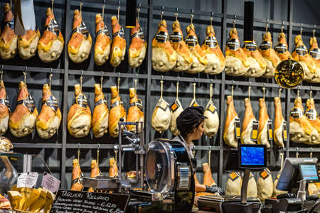 BOLOGNA, ITALY - DECEMBER 16, 2018:  clerk waiting for customers at TAGLIERI RULIANO ham shop at FICO Eataly World, the largest gourmet agri-food park in the worldのeditorial素材