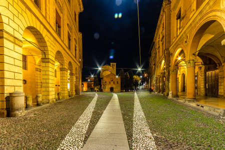 BOLOGNA, ITALY - DECEMBER 10, 2018: lights are enlightening night view of ancient square of Saint...