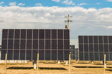 view of photovoltaic panels farm in countryside