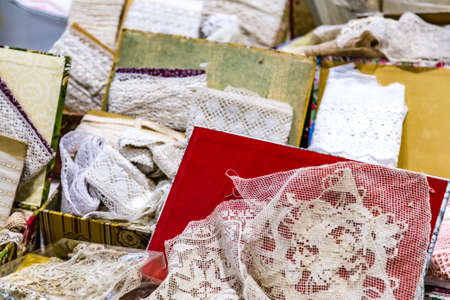 piles of white lace for sale