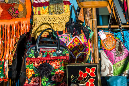 CESENA, ITALY - JANUARY 20, 2019: lights are enlightening vintage bags for sale in Antiques Fair