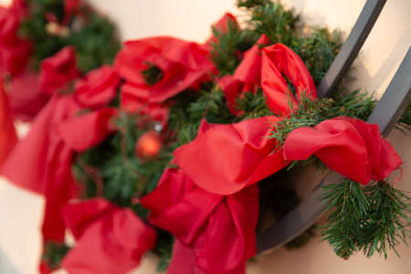 red ribbons and green needles in Christmas decorationsの写真素材