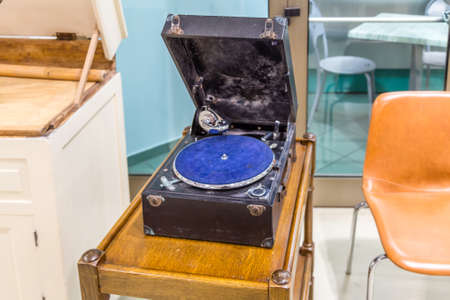 CESENA, ITALY - JANUARY 20, 2019: lights are enlightening record player  for sale in Antiques Fairのeditorial素材