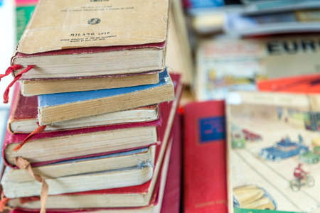 CESENA, ITALY - JANUARY 20, 2019: lights are enlightening old books for sale in Antiques Fair