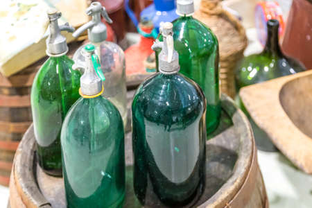 CESENA, ITALY - JANUARY 20, 2019: lights are enlightening seltzer bottles  for sale in Antiques Fairのeditorial素材