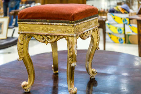 CESENA, ITALY - JANUARY 20, 2019: lights are enlightening stool for sale in Antiques Fairのeditorial素材