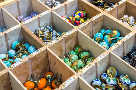 CESENA, ITALY - JANUARY 20, 2019: lights are enlightening knobs for sale in Antiques Fairのeditorial素材