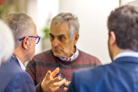 BOLOGNA, ITALY - FEBRUARY 18, 2019: Booth presenter talking with visitor at stand of ANGELO AREZZO SAS in DEVOTIO Religious products and service exhibitionのeditorial素材
