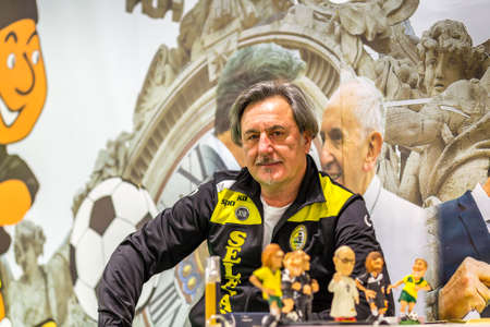 BOLOGNA, ITALY - FEBRUARY 18, 2019: booth presenter waiting for visitors at stand of football priest team in DEVOTIO Religious products and service exhibitionのeditorial素材