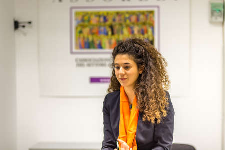 BOLOGNA, ITALY - FEBRUARY 18, 2019: booth presenter waiting for visitors at stand of ASSORELLI in DEVOTIO Religious products and service exhibitionのeditorial素材
