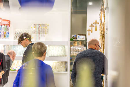 BOLOGNA, ITALY - FEBRUARY 18, 2019: booth presenters waiting for visitors at stand of TIESSE in...