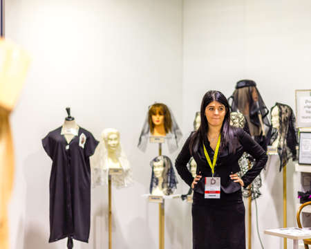 BOLOGNA, ITALY - FEBRUARY 18, 2019: booth presenter waiting for visitors at stand of LE VELETTE DI MIRIAM in DEVOTIO Religious products and service exhibitionのeditorial素材
