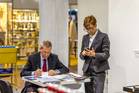 BOLOGNA, ITALY - FEBRUARY 18, 2019: booth presenter waiting for visitors at stand of ALDO BOVE in...