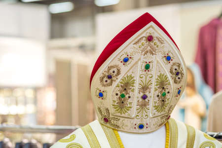 BOLOGNA, ITALY - FEBRUARY 18, 2019: lights are enlightening holy vestments at stand of MARANATHA, in...