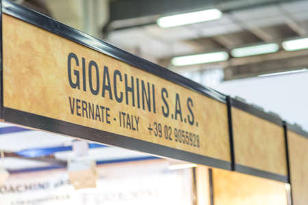 BOLOGNA, ITALY - FEBRUARY 18, 2019: lights are enlightening GIOACHINI logo on signboard on stand in DEVOTIO Religious products and service exhibitionのeditorial素材