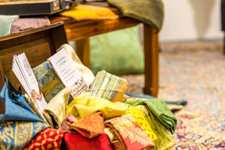 BOLOGNA, ITALY - FEBRUARY 18, 2019: lights are enlightening fabrics for holy vestments at stand of BARTARTE, in DEVOTIO Religious products and service exhibitionのeditorial素材