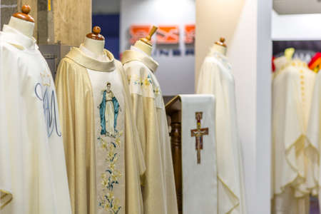 BOLOGNA, ITALY - FEBRUARY 18, 2019: lights are enlightening holy vestments at stand in DEVOTIO Religious products and service exhibitionのeditorial素材