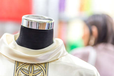 BOLOGNA, ITALY - FEBRUARY 18, 2019: lights are enlightening holy vestments at stand of GLESANT, in DEVOTIO Religious products and service exhibitionのeditorial素材