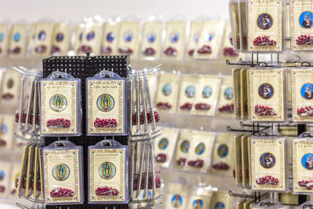 BOLOGNA, ITALY - FEBRUARY 18, 2019: lights are enlightening rosaries at stand of  ATS ITALIA EDITRICE in DEVOTIO Religious products and service exhibitionのeditorial素材