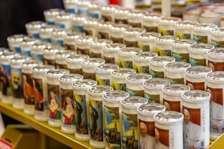 BOLOGNA, ITALY - FEBRUARY 18, 2019: lights are enlightening candles at stand of LUMICART, in DEVOTIO Religious products and service exhibitionのeditorial素材