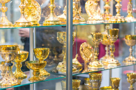 BOLOGNA, ITALY - FEBRUARY 18, 2019: lights are enlightening goblets at stand of ALBRIZZI GIUSEPPE, in DEVOTIO Religious products and service exhibitionのeditorial素材