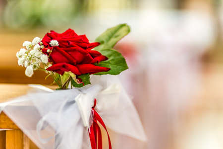 flowers decorating the benches of a Catholic Churchの写真素材