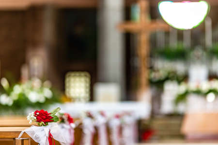 flowers decorating the benches of a Catholic Churchの写真素材