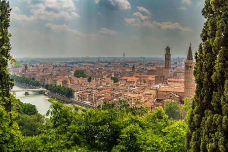 Amazing panorama of the Adige River running along ancient buildings of Verona, Italyの写真素材