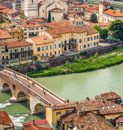 Amazing panorama of the Adige River running along ancient buildings of Verona, Italyの写真素材
