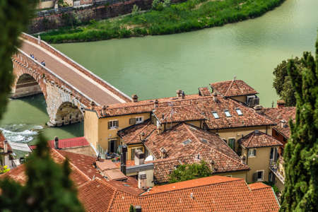 Amazing panorama of the Adige River running along ancient buildings of Verona, Italyの写真素材