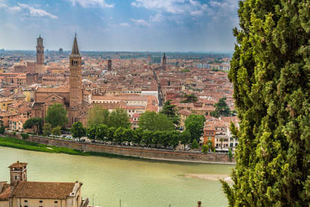 Amazing panorama of the Adige River running along ancient buildings of Verona, Italy