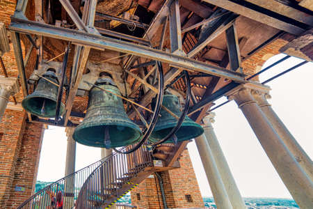 VERONA (VR), ITALY - MAY 10, 2019: sunlight is enlightening bells in Lamberti Tower in Verona, city of lovers in Italyのeditorial素材