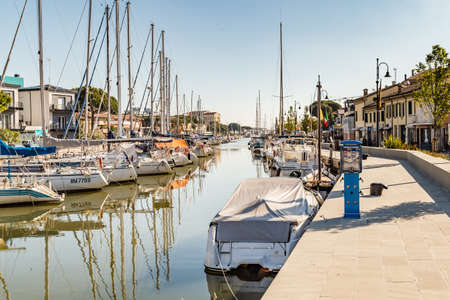 CERVIA (RA), ITALY - MAY 17, 2019: boats mooring in port channel of Cervia.のeditorial素材